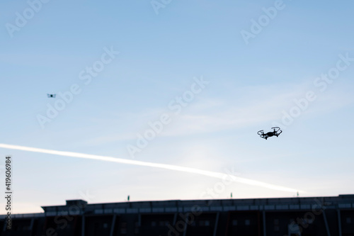 Two drones are flying in the sky. Drone control. Panorama 