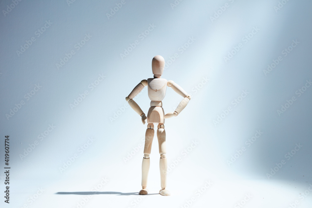 wooden mannequin in studio on white background wooden mannequin in studio on white background