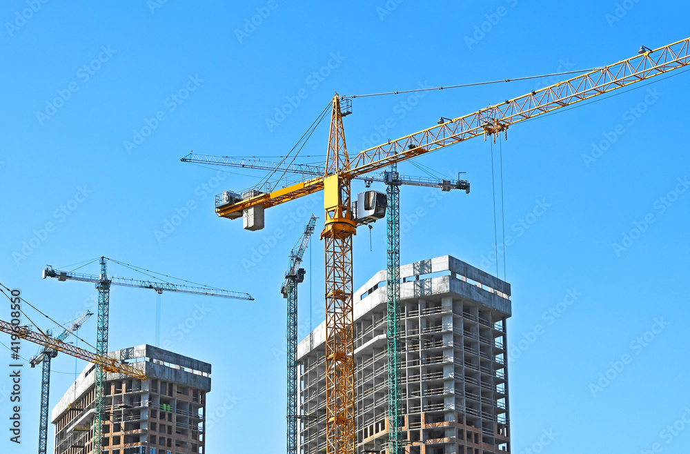 Crane and highrise construction site