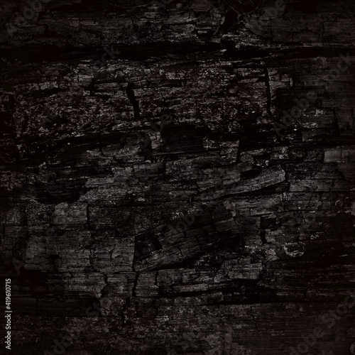 black rugged background, carbon texture