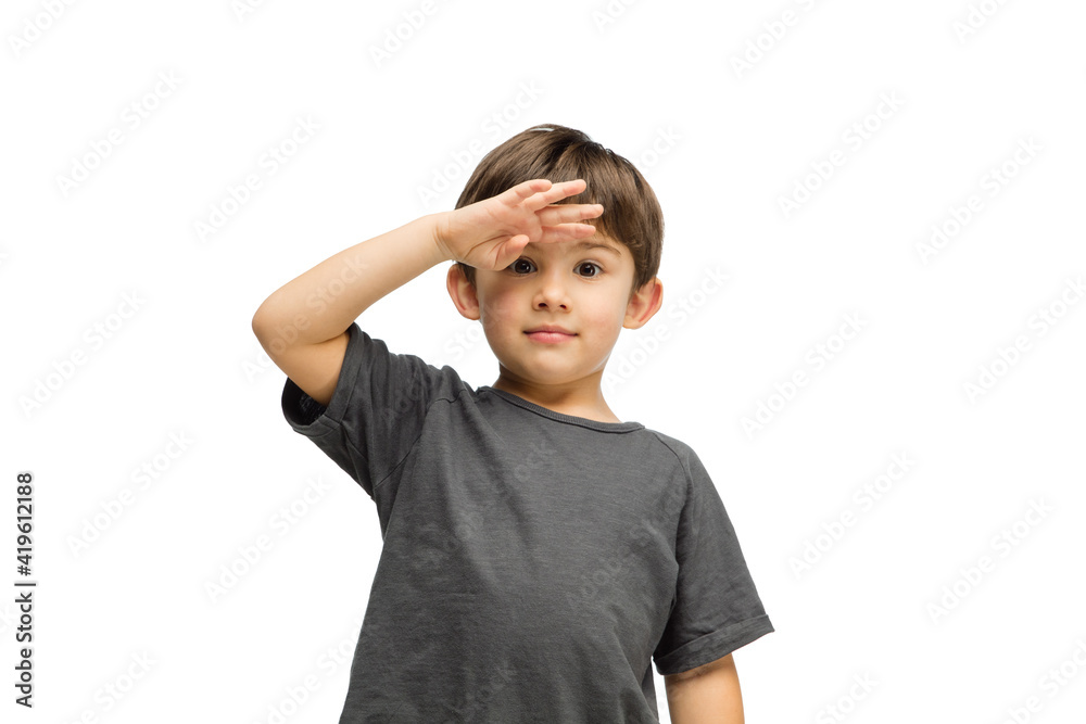 Looking for. Happy, smiley little caucasian boy isolated on white studio background with copyspace for ad. Looks happy, cheerful. Childhood, education, human emotions, facial expression concept. Looking for. Happy, smiley little caucasian boy isolated on white studio background with copyspace for ad. Looks happy, cheerful. Childhood, education, human emotions, facial expression concept.