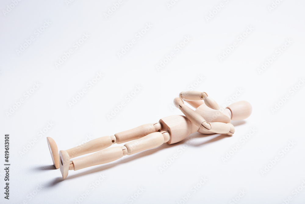 wooden mannequin in different poses on a white background wooden mannequin in different poses on a white background