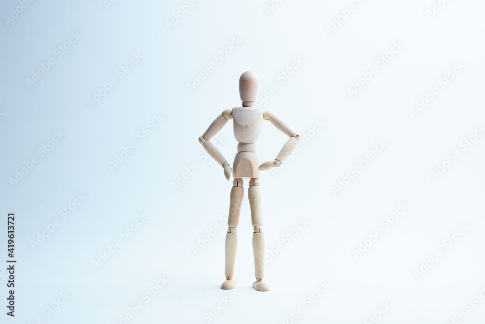 wooden mannequin in different poses on a white background wooden mannequin in different poses on a white background