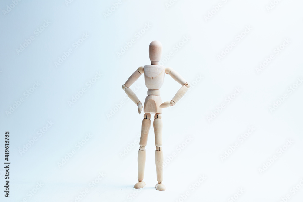 wooden mannequin in different poses on a white background wooden mannequin in different poses on a white background
