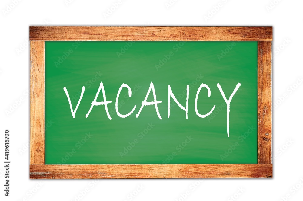 Fototapeta premium VACANCY text written on green school board.