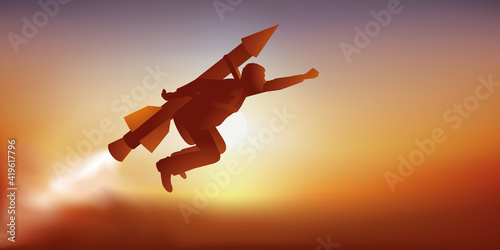 Symbole du challenge impossible avec un homme audacieux qui décolle accroché à une fusée pour atteindre son objectif. photo