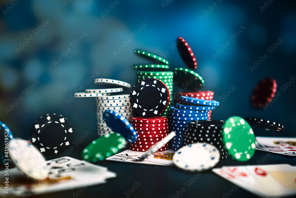 poker chips falling, casino table with card gambling game