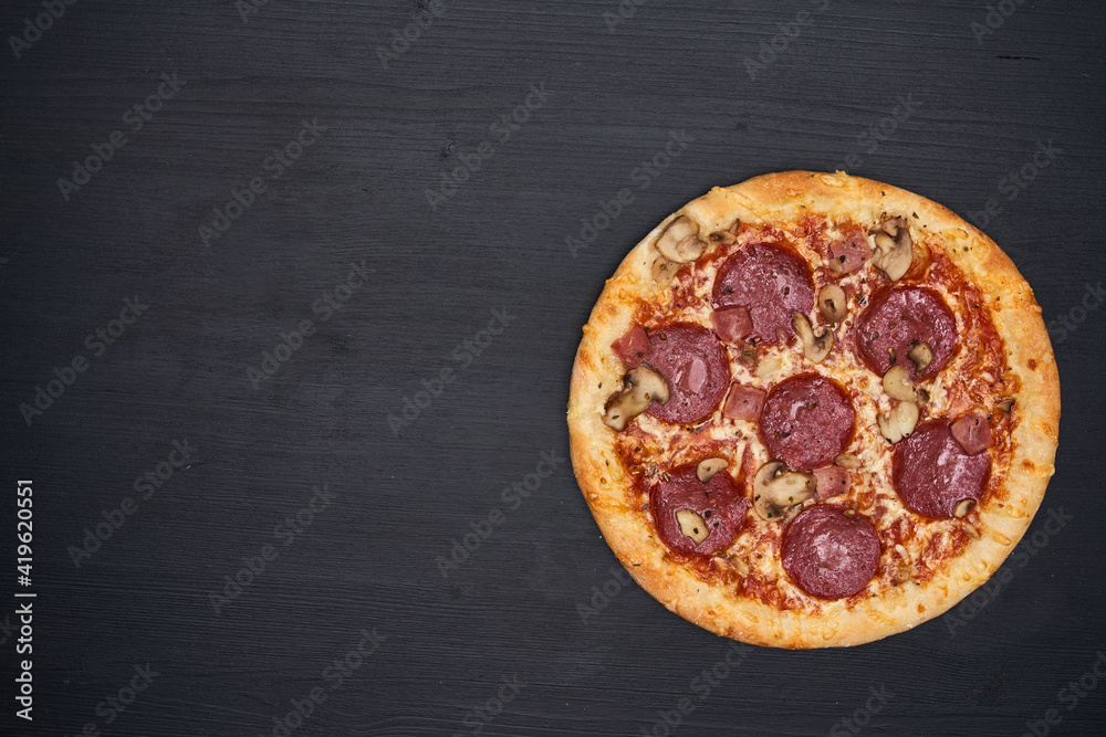 Delicious pizza on wooden board