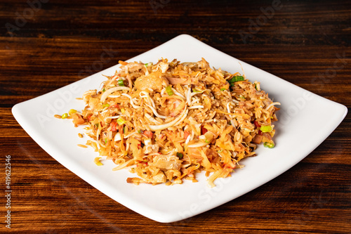 A plate of oriental food special fried rice