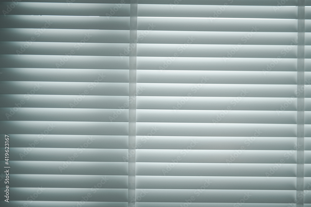 Obraz premium Window with white PVC blinds