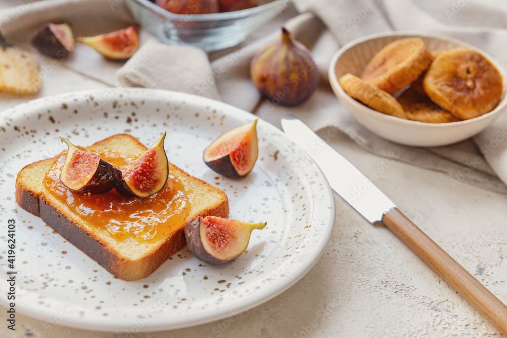 Toast with sweet fig jam on grunge background Toast with sweet fig jam on grunge background