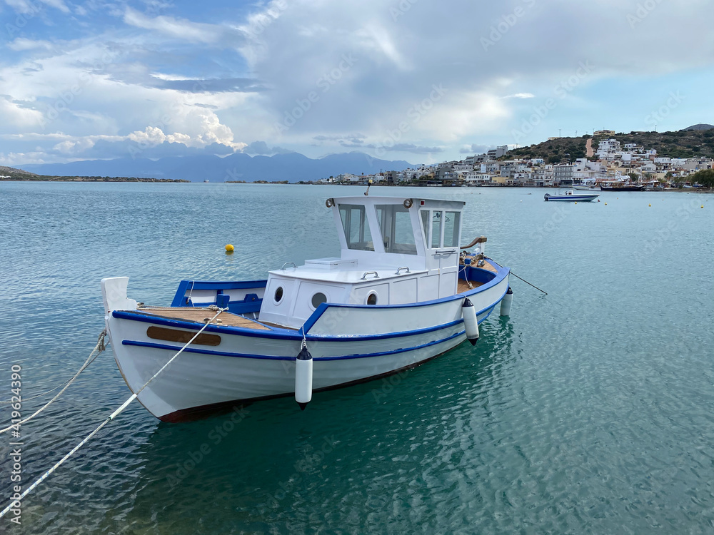  View on  Elounda harbour with white boat  on Crete Island, Greece