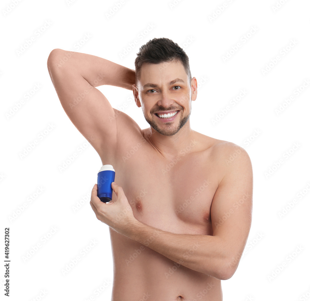Fototapeta premium Handsome man applying deodorant isolated on white