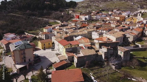 Aerial view over Pietraroja, an italian village on top of a hill, on a bright sunny day photo