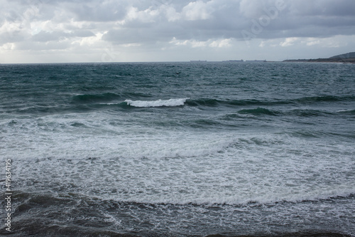 Foam at the shore from the sea wave