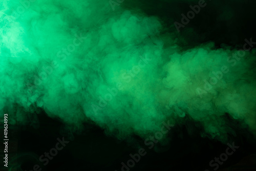 Texture of green smoke on a black background