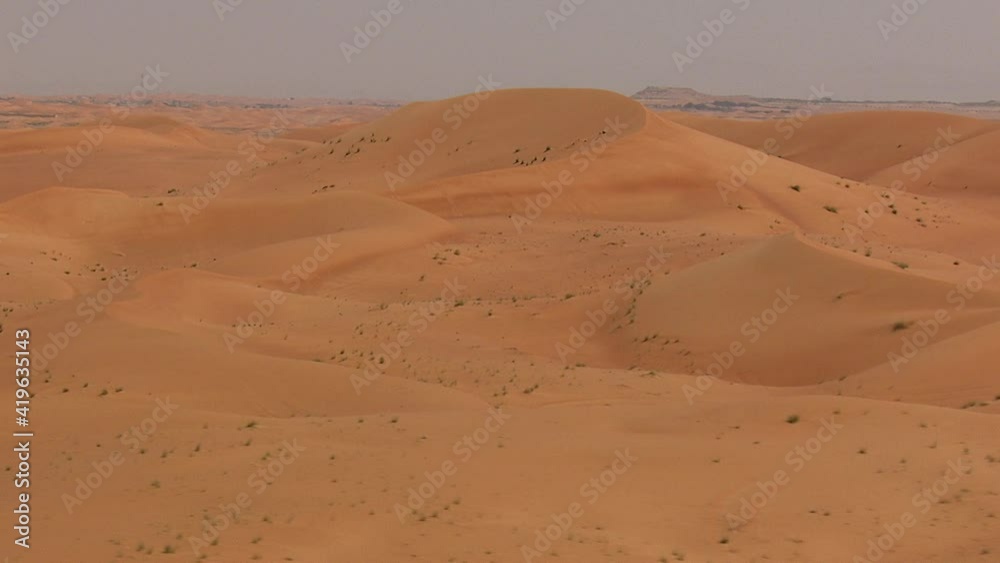 Desert dunes fly over in daytime Desert dunes fly over in daytime