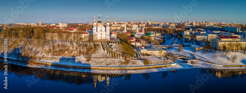 Panoramic view of Dvina river and city of Vitebsk with cathedral orthodox church on the hill and oold town. Aerial view. Travel concept.