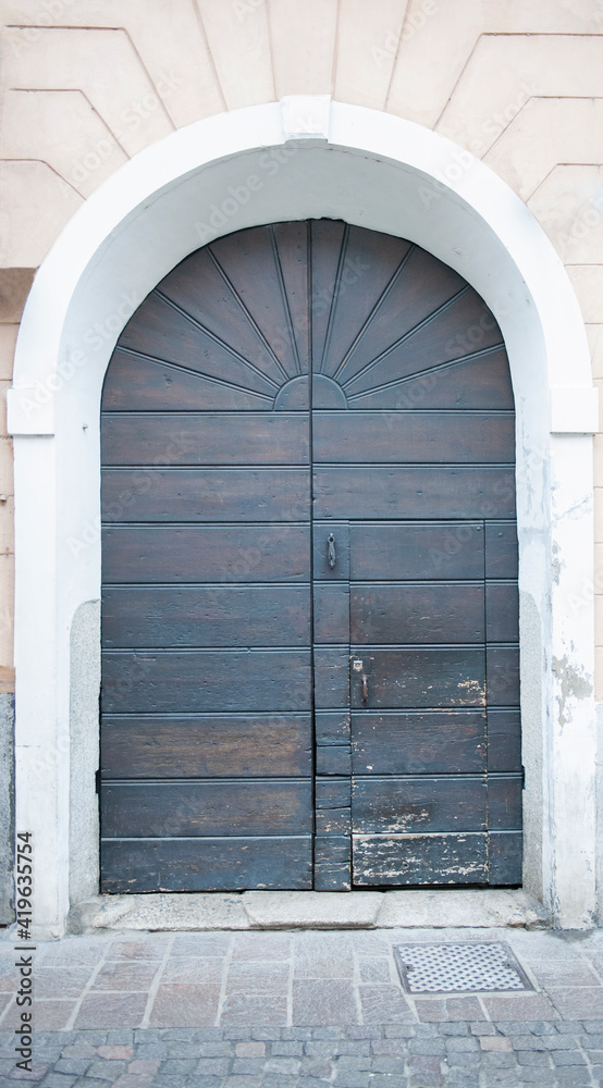 Fototapeta premium Front entrance door leading to a house in Italy