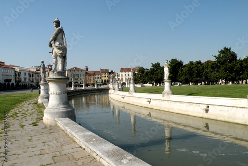 Prato della Valle is a large elliptical square with statues, fountains and colorful houses. It is the largest square in Padua and the largest in Europe.