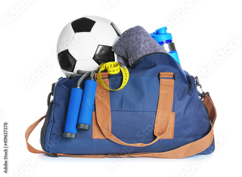 Bag with sports equipment on white background