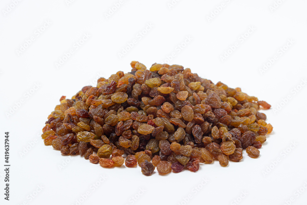 Isolated raisins on a white background. Healthy dried fruit. Dried grapes. Isolated raisins on a white background. Healthy dried fruit. Dried grapes.