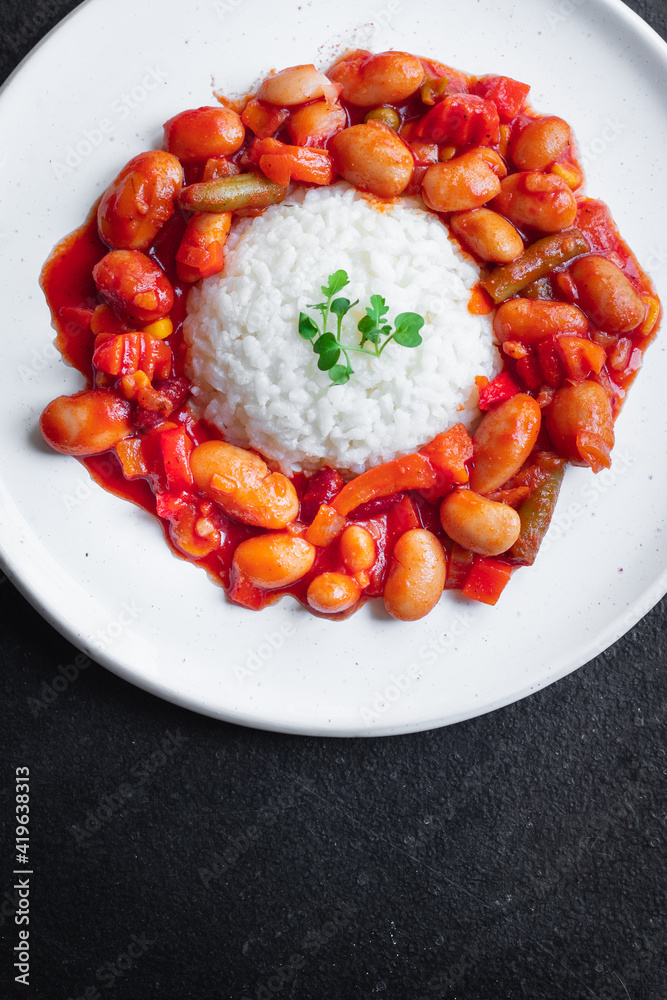 rice tomato beans vegetable no meat portion meal snack top view copy space food background rustic image keto or paleo diet vegan or vegetarian rice tomato beans vegetable no meat portion meal snack top view copy space food background rustic image keto or paleo diet vegan or vegetarian