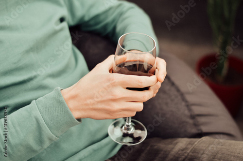 man holding a glass of wine