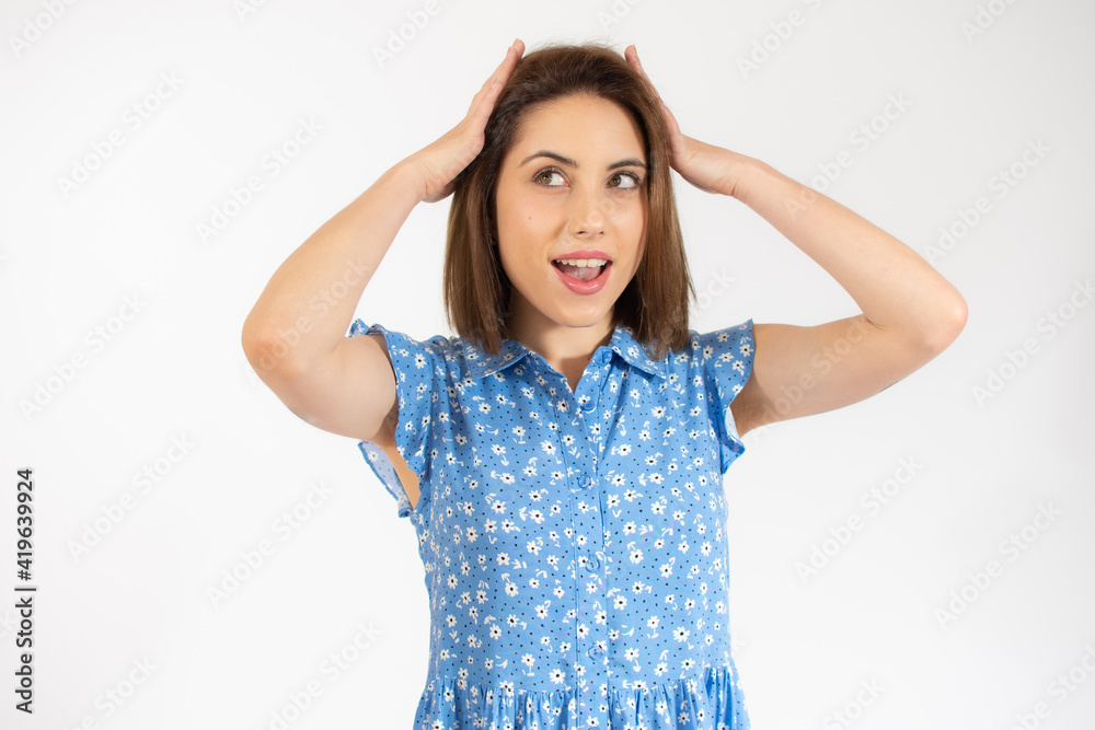 Close-up portrait of young pretty surprised woman with opened mouth standing with open palms, isolated over white background Close-up portrait of young pretty surprised woman with opened mouth standing with open palms, isolated over white background