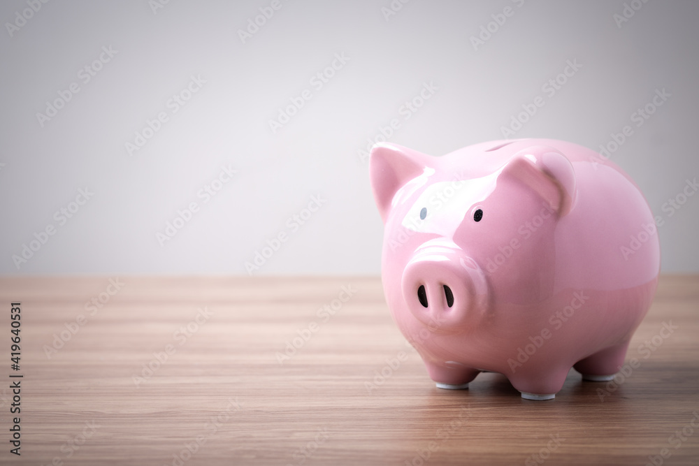 Pink piggy bank saving money for future plan and retirement fund, business financial investment saving concept. Pink piggy bank saving money for future plan and retirement fund, business financial investment saving concept.
