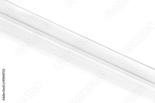 White zipper isolated on white background. Clothing fastener.