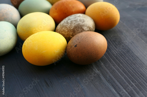 Easter eggs natural dyed on wooden background.