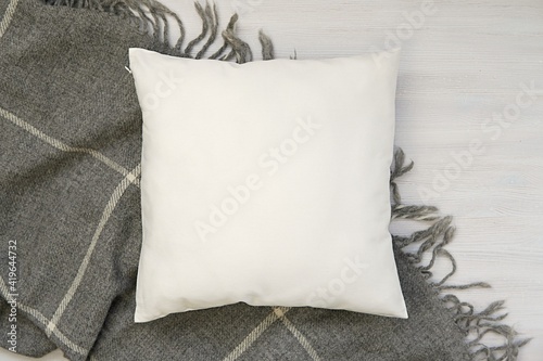 White blank pillow mockup, cozy winter composition with and warm wool blanket, square pillow case, cushion mockup.