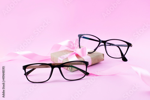 Black Eyeglasses On Pink Background 