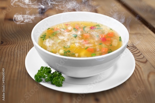 Bowl of delicious vegetable soup on a table