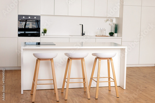 interior of a white kitchen in a Scandinavian style. Soft selective focus.