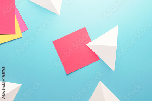 Blank notes paper with arrows on light blue, texture background