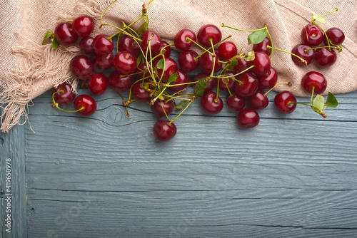Fresh cherries on wood background
