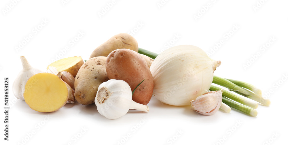 Raw potato, onion and garlic on white background Raw potato, onion and garlic on white background