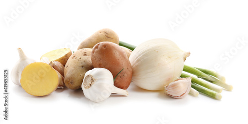 Raw potato, onion and garlic on white background