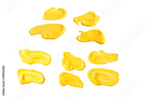 Yellow sauce splashes isolated on white background.