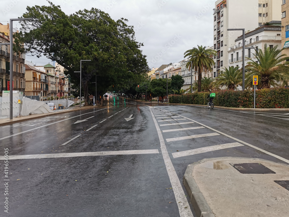 Málaga, Spain - February 21, 2021: View of the streets and buildings of Soho in Málaga ia rainy day