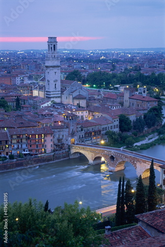 The Ponte Pietra and Anastasia Cathedral at dusk from the Museo Archeologico in the town of Verona, Veneto photo