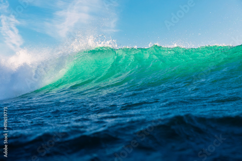 Fototapeta Naklejka Na Ścianę i Meble -  Turquoise waves in ocean. Breaking wave with light