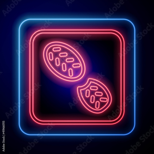 Glowing neon Human footprints shoes icon isolated on black background. Shoes sole. Vector.