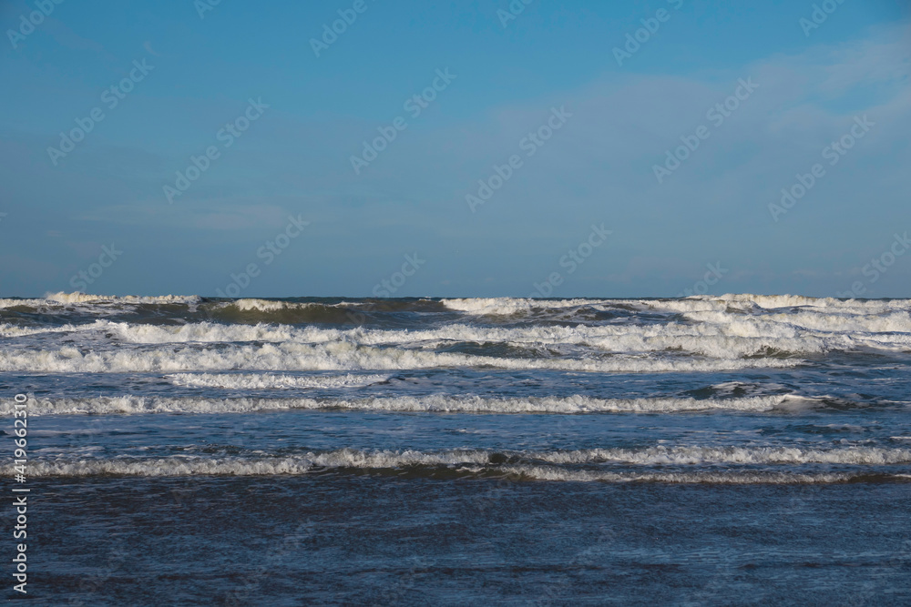 the sea with blue sky and waves