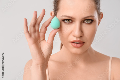 Beautiful young woman with ...