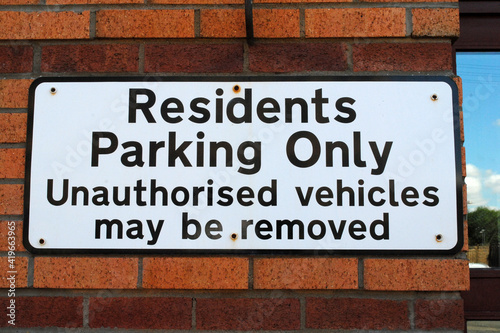 Prominent Metal Sign on Side of Building  'Residents Parking Only'  © eyepals