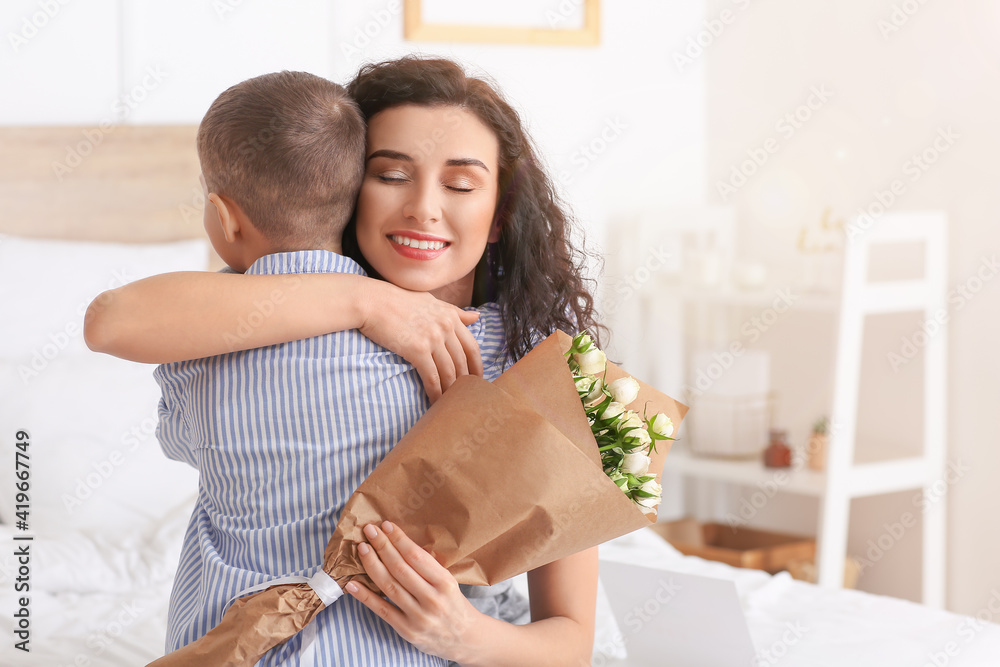 Little boy greeting his mom on Mother's Day at home Little boy greeting his mom on Mother's Day at home
