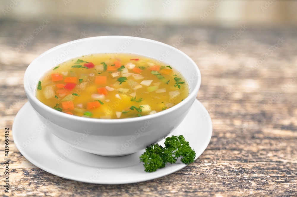 Bowl of delicious vegetable soup on a table Bowl of delicious vegetable soup on a table